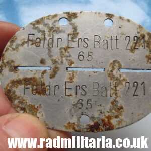 & original German DOG TAG - ID DISC metal detecting find: FELDR. ERS. BATL. 221. 65.