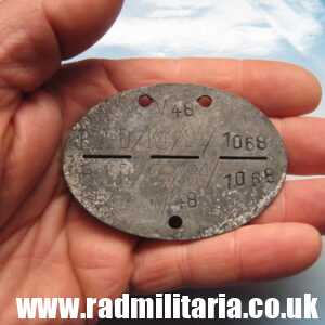 & WW2 original German DOG TAG - ID DISC from metal detecting. M48 RAD/K4/84/1068.