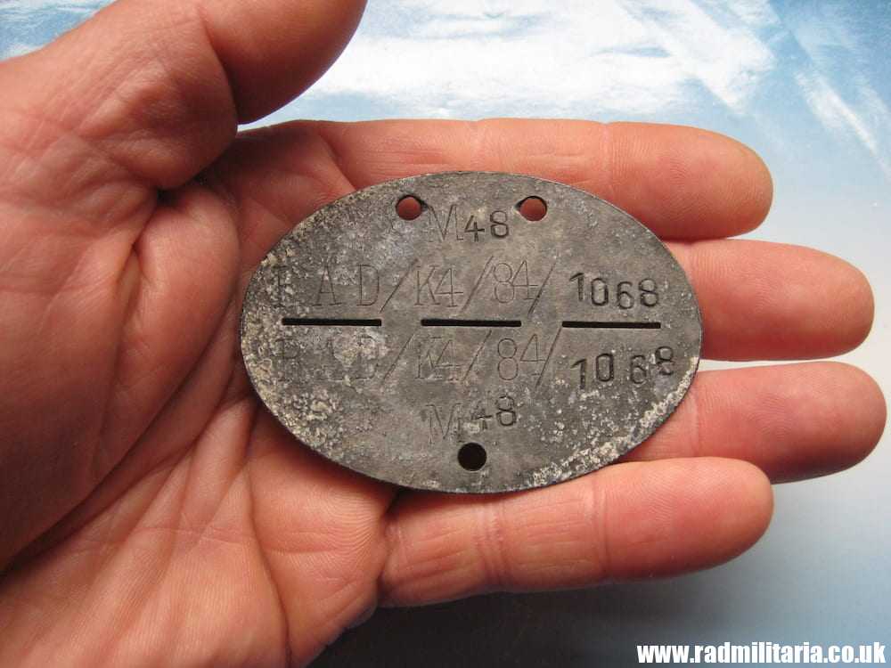 & WW2 original German DOG TAG - ID DISC from metal detecting. M48 RAD/K4/84/1068.