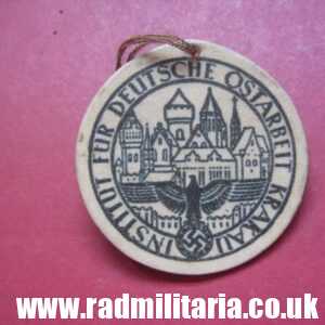 & unknown WW2 German CARDBOARD BADGE: Institut Fur Deutsche Ostarbeit Krakau.