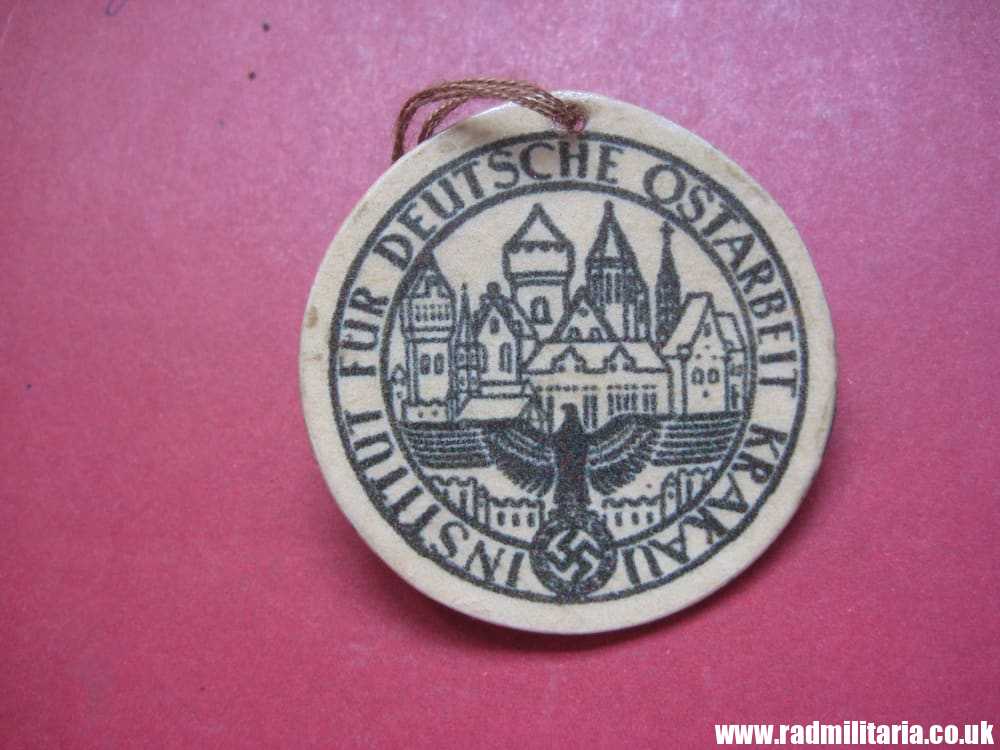 & unknown WW2 German CARDBOARD BADGE: Institut Fur Deutsche Ostarbeit Krakau.