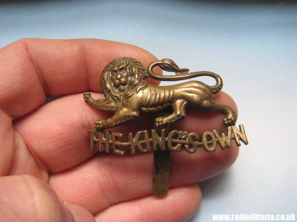 & WW1 British Regimental badge - CAP BADGE: The King's Own Royal Regiment, Lancaster - Genuine.