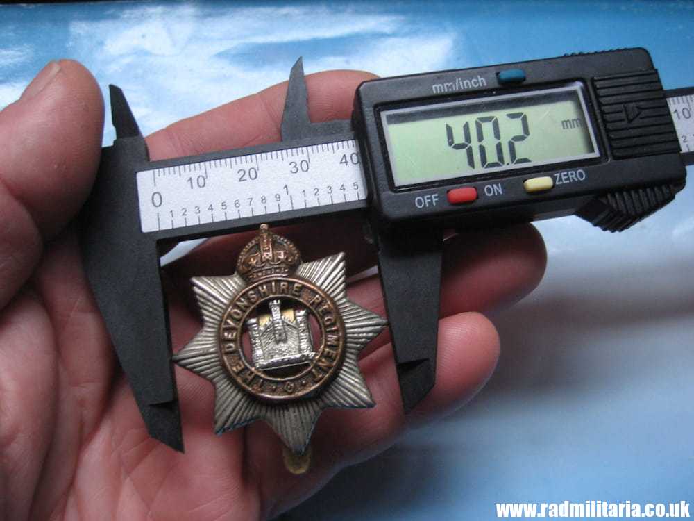 & WW1 original British CAP BADGE - Devonshire Regiment, maker: F.N B'HAM. - Image 11