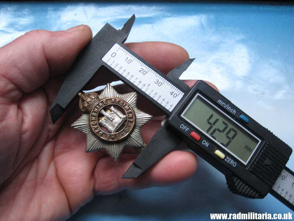 & WW1 original British CAP BADGE - Devonshire Regiment, maker: F.N B'HAM. - Image 12