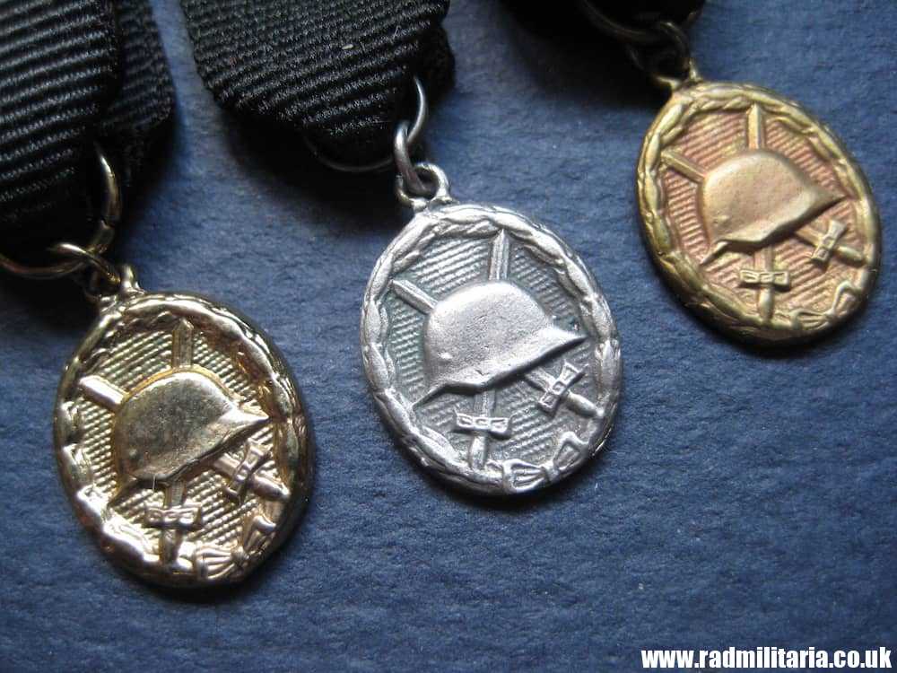 & post WW2 German WOUND BADGES - set of 3 small badges in good condition.