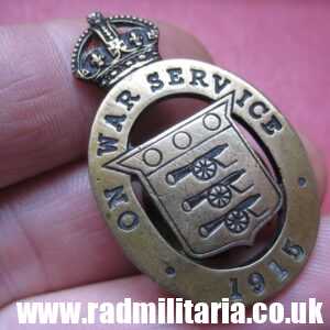 & WW1 original British metal BADGE: 1915 - ON WAR SERVICE no. 75, maker: Woolley & Co (Birm.) Ltd