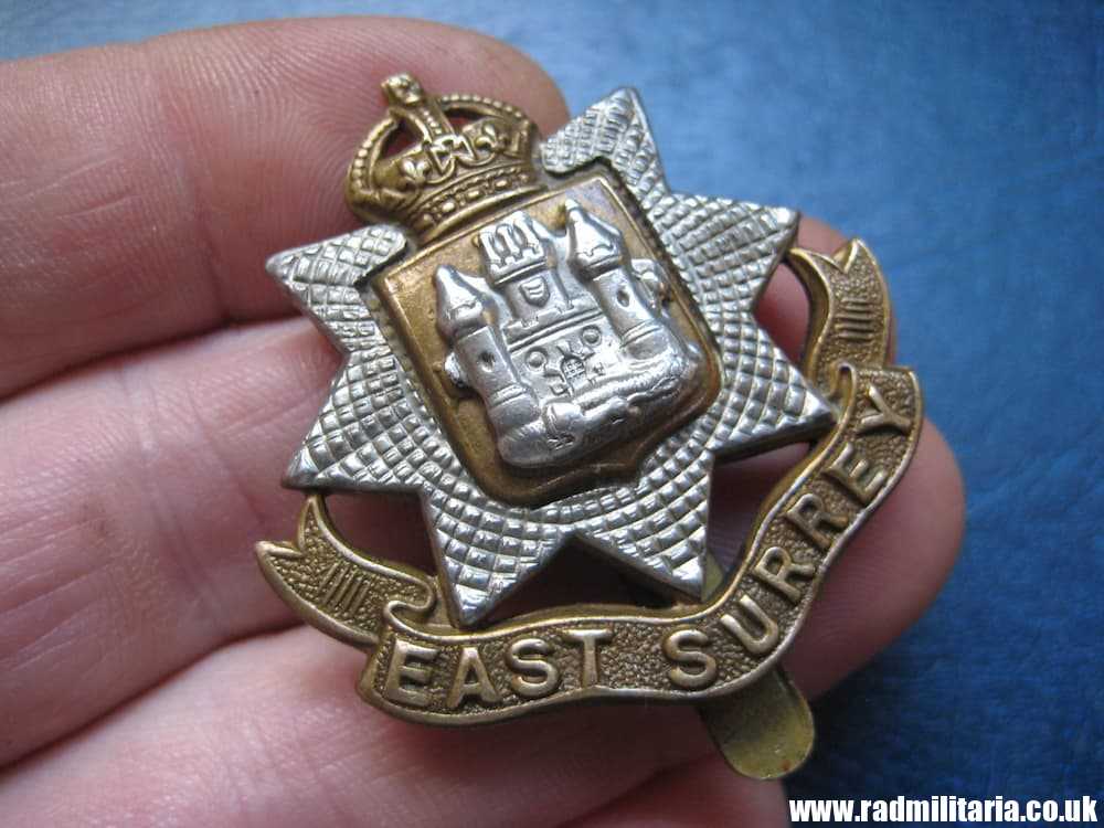 & WW1/WW2 British Regimental badge - CAP BADGE: East Surrey Regiment Badge - King's Crown.