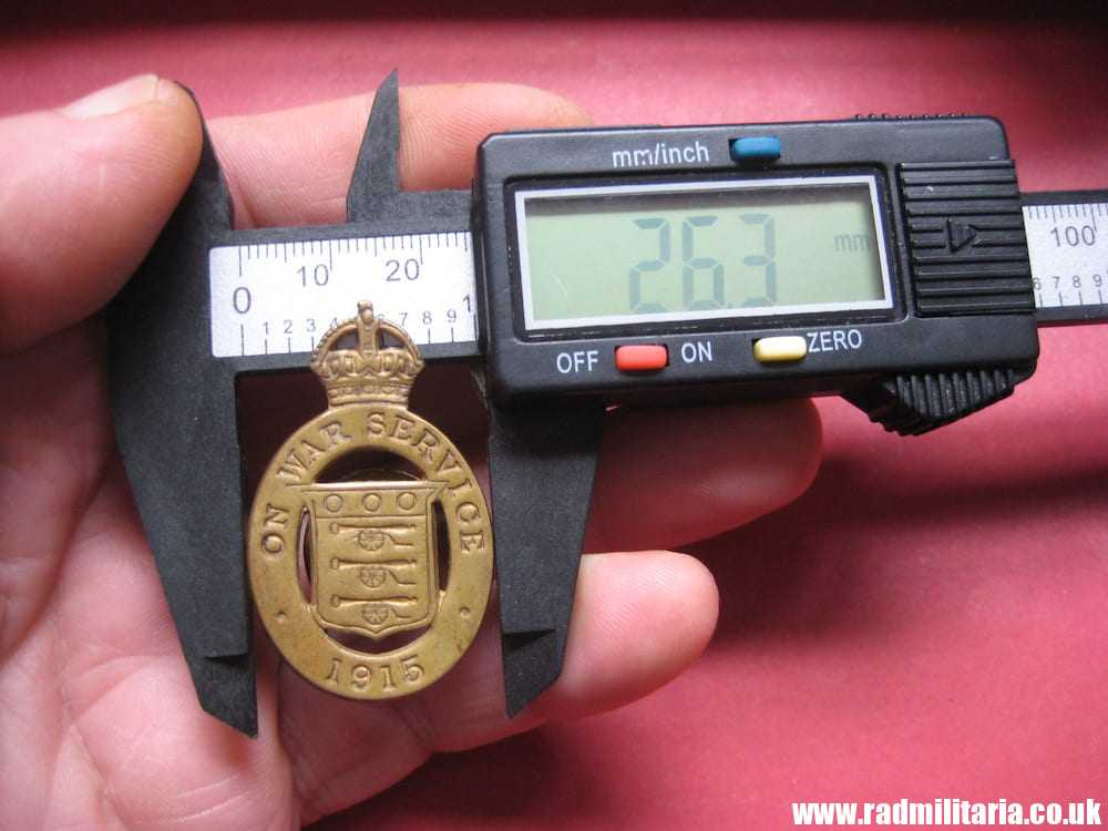 & WW1 original British metal BADGE 1915 - ON WAR SERVICE no. 1183, maker: J. A. Wylie & Co London.