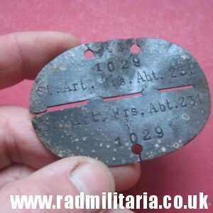 & original German DOG TAG – ID DISC in poor condition: 1029 St. Art. Ers. Abt. 231 - metal detecting find.