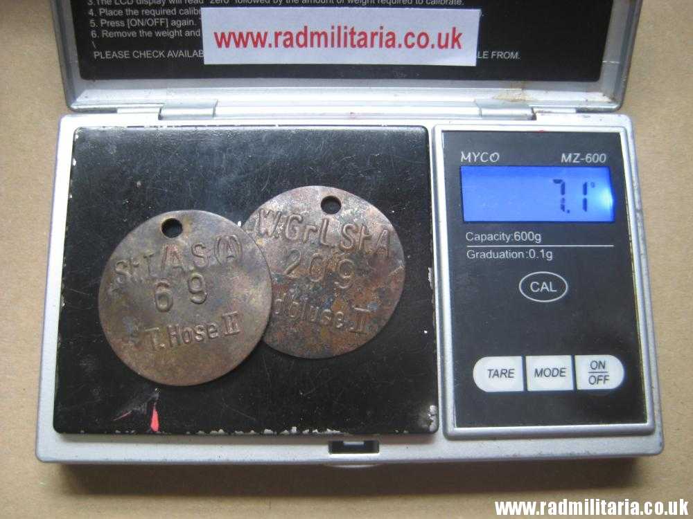 & WW2 unknown Wehrmacht uniform DOG TAGS - SET of 2: "W.Gr.L.St.A 209 Feldbluse II" & "St.I/A.S.(A) 69 T.Hose II" - Image 9