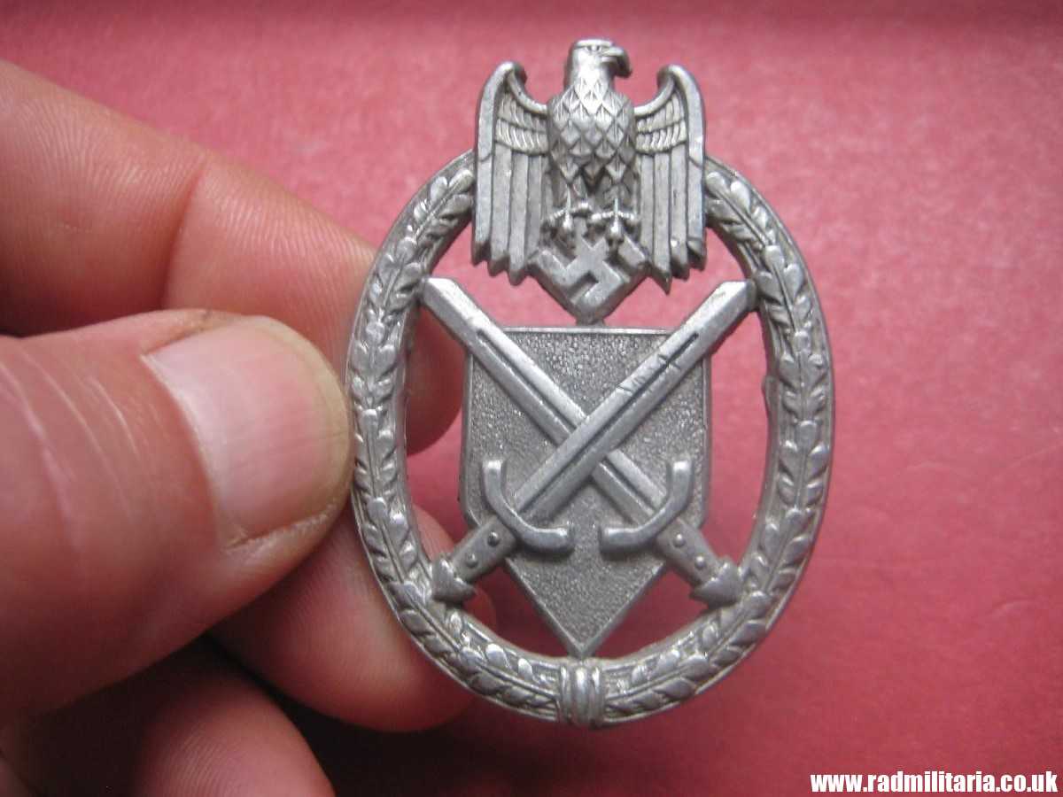 & WW2 German metal BADGE: SCHUTZENSCHNURE DES DEUTSCHEN HEERES maker: Assmann