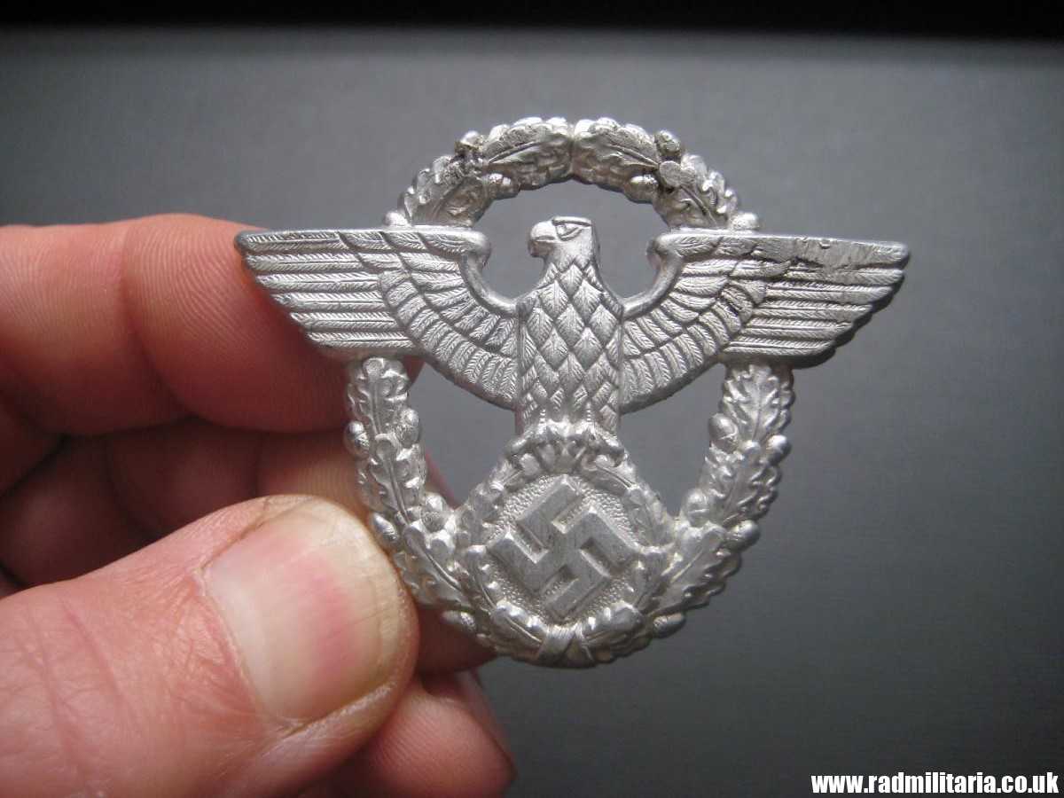 & WW2 original German EAGLE BADGE - CAP BADGE maker marks: "A" Assmann - GENDARMERIE.