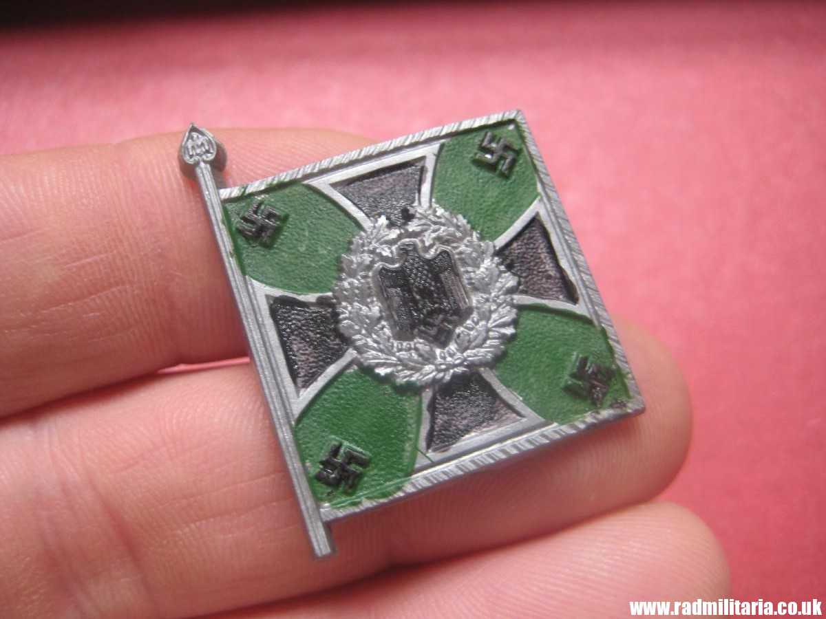 & WW2 German PLASTIC tinnie BADGE - WHW FLAG - Jager We.3 complete badge in very good condition.