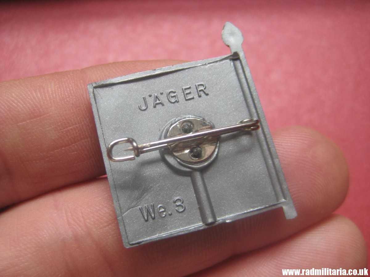 & WW2 German PLASTIC tinnie BADGE - WHW FLAG - Jager We.3 complete badge in very good condition. - Image 4