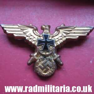 & original German KRIEGSMARINE EAGLE BADGE - gilded BADGE marked: GES. GESCH.
