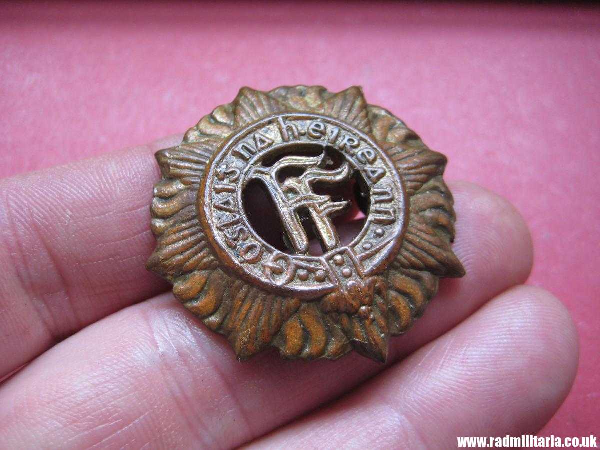 & genuine IRISH Defence Forces CAP BADGE in good used condition.
