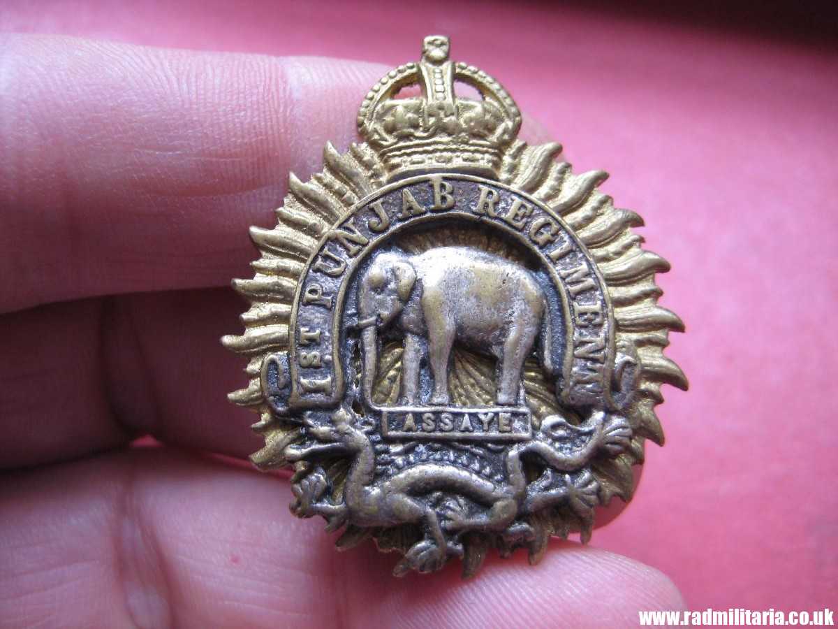 & CAP BADGE: British Indian Army 1st Punjab Regiment bi-metal badge.