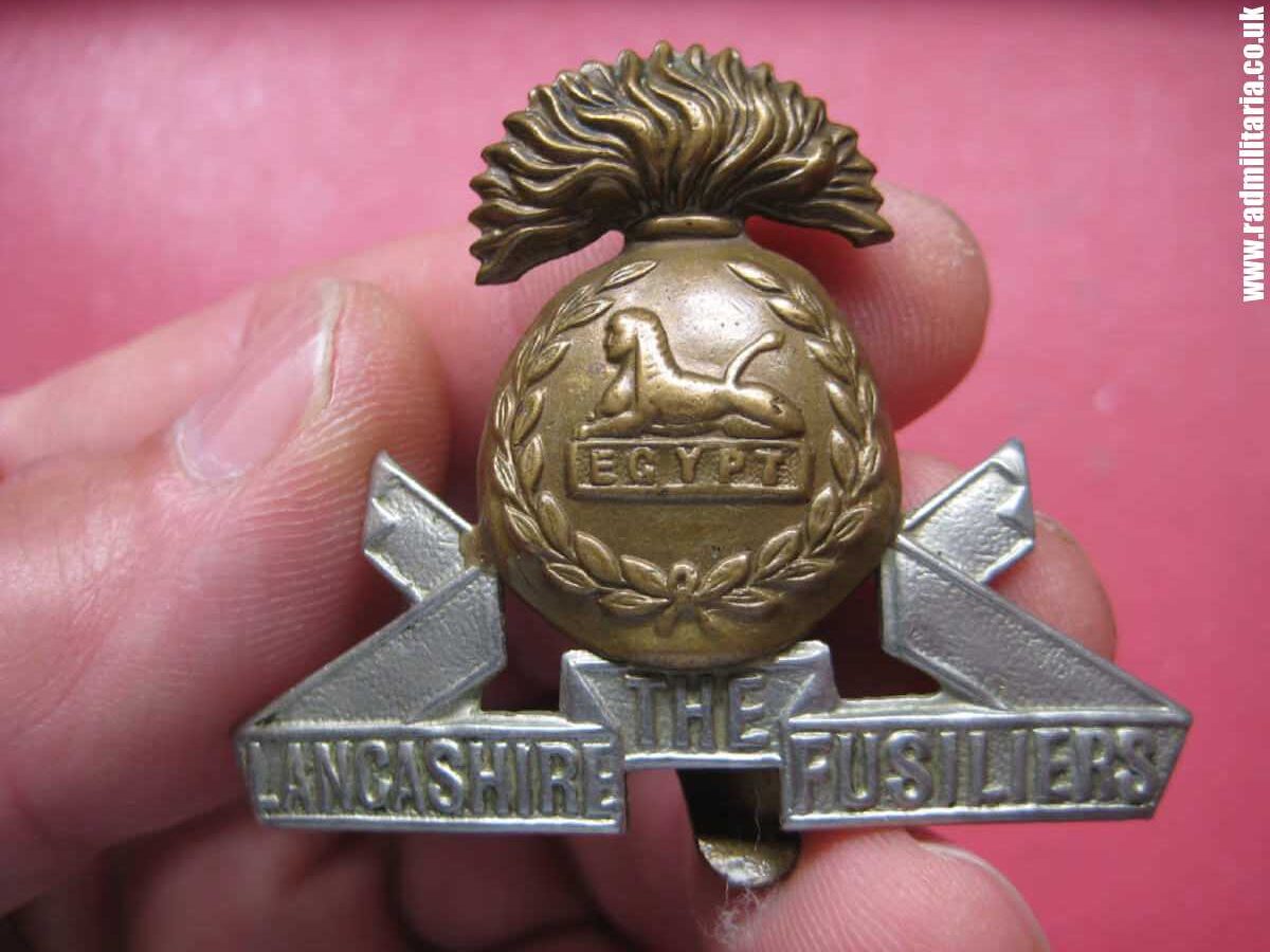 & WW2 British Army bi-metal CAP BADGE - Lancashire Fusiliers Regiment.