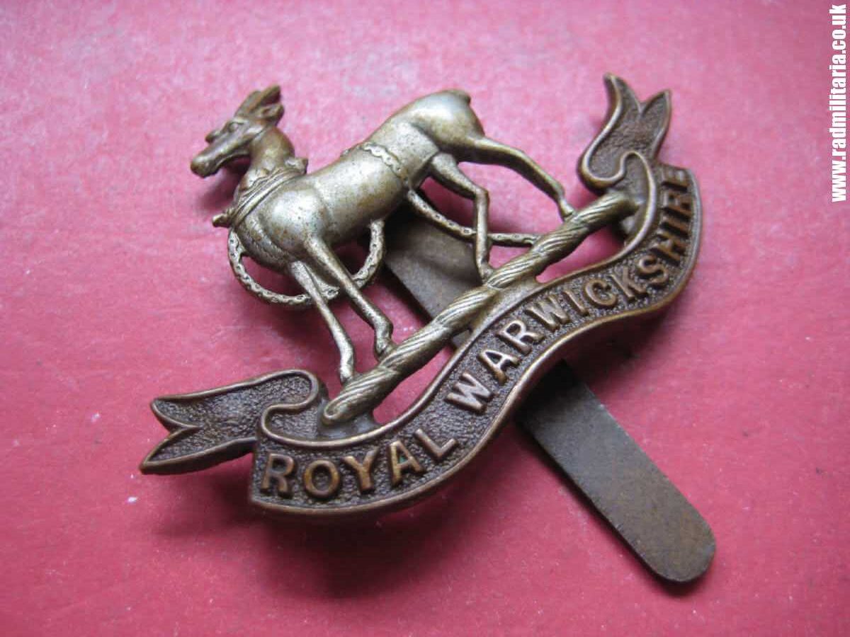 & WW1 British CAP BADGE: Royal Warwickshire Regiment.