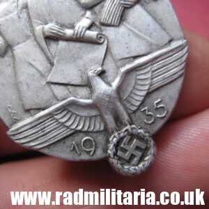 & WW2 original German TINNIE BADGE - Tag Der Arbeit 1935 marked: JFS - Josef Feix Sohne, Gablonz.