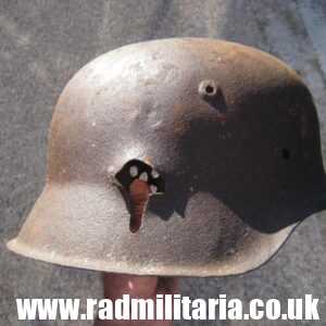 & original WW2 German steel HELMET M42 - winter camouflage.